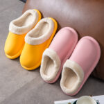 Yellow OAKAA winter slipper with closed toe and plush lining