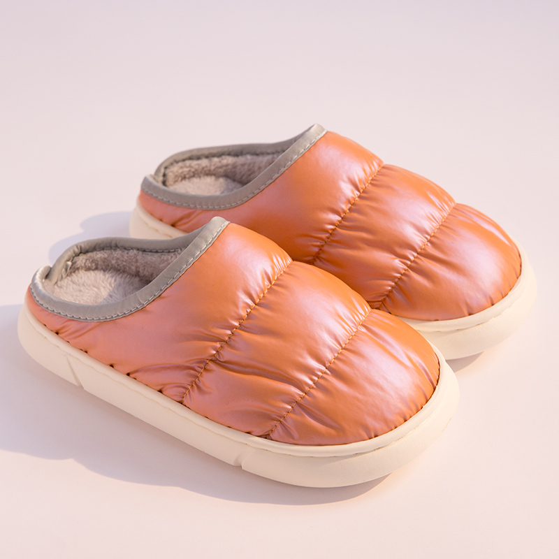 Orange unisex puffer winter slippers with quilted padded upper and soft sole